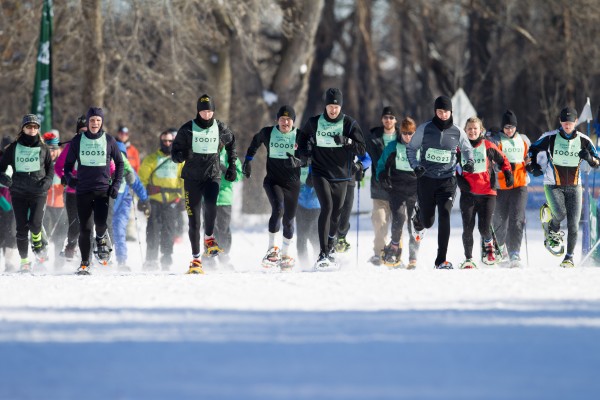 The start of the 2014 1st Annual Snowshoe Loppet race with winner Kelly Mortenson, St Paul (17), Jim Graupner, Lake Elmo (32) Ryan Albu, Mpls (23) and Jose Jorde, Cambridge (34). Women's group are Sarah Pitts, Mpls (12), Pam Nielsen, Minnetonka (3)